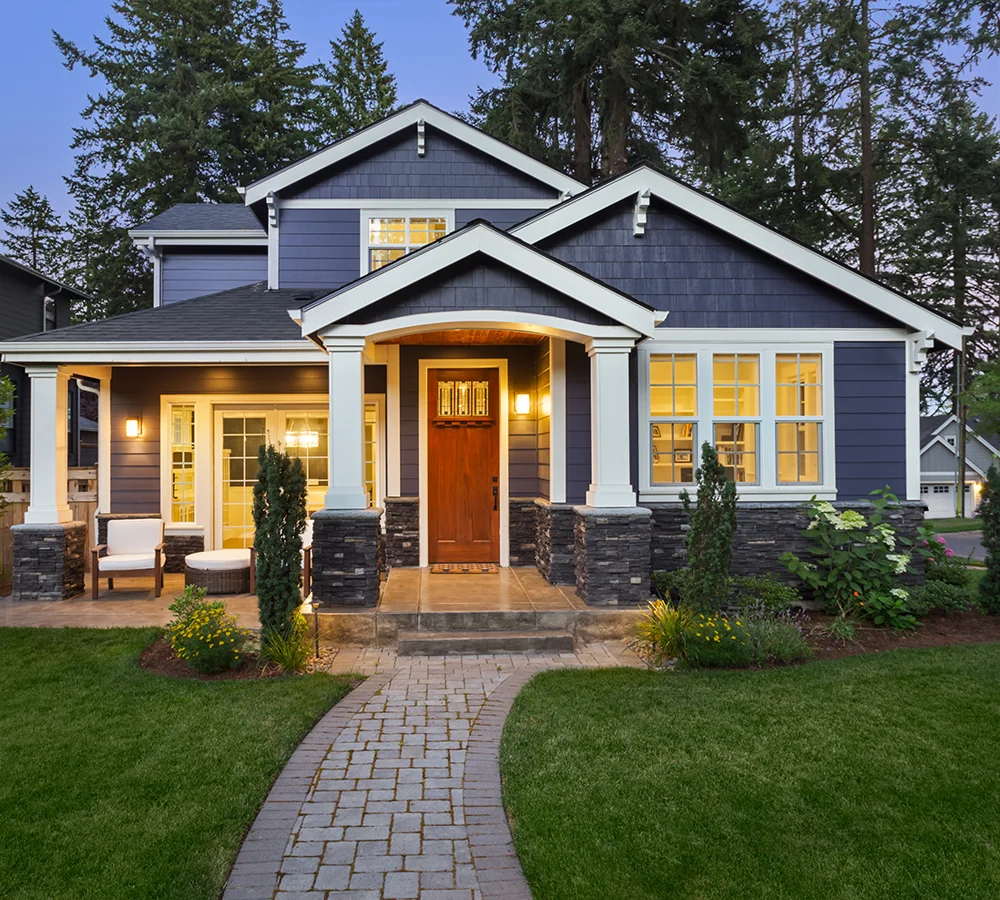 lighted home with blue siding